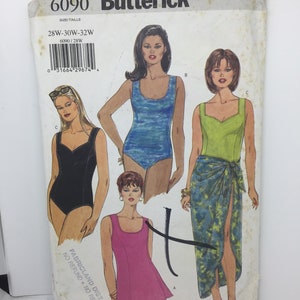 May include: A sewing pattern for a swimsuit with three different styles. The pattern is for sizes 28W, 30W, and 32W. The pattern is from Butterick and the pattern number is 6090.
