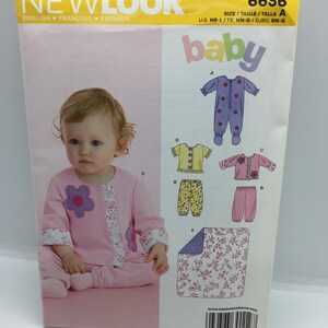 May include: A sewing pattern for baby clothes, including a onesie, trousers, and a blanket. The pattern is from Newlook and is size A, which is for newborns to 12 months. The pattern number is 6636.
