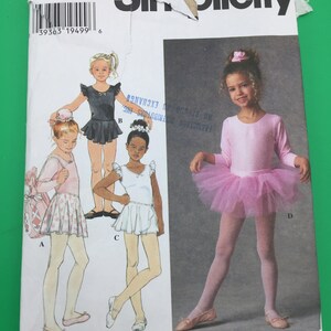May include: A sewing pattern for a ballet costume for girls. The pattern includes four different styles: a white skirt with a pink top, a black skirt with a white top, a white skirt with a white top, and a pink tutu with a pink top. The pattern is for sizes 3, 4, 5, and 6.