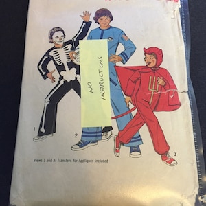 May include: A vintage sewing pattern for three Halloween costumes for boys. The pattern includes a skeleton, astronaut, and devil costume. The pattern is for sizes 10-12 and is labeled "Robert".