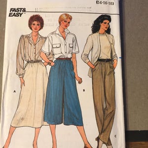 May include: A vintage Butterick sewing pattern featuring illustrations of three women in different outfits. The pattern includes the text "FAST & EASY" and size information (14-16-18). The outfits include a striped blouse and skirt, a white shirt and blue culottes, and a blazer with pants.