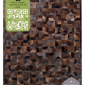 May include: A brown and black geometric patterned cowhide rug. The rug is made of leather and has a unique design. The rug is perfect for adding a touch of rustic elegance to any room.