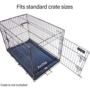May include: A blue dog bed with the name "Archie" embroidered on it. The bed is inside a metal dog crate with the door open. The crate is designed to fit standard crate sizes.