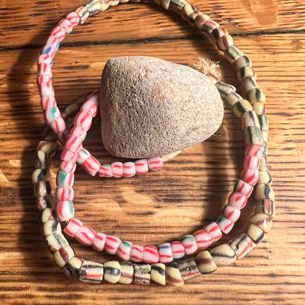 A Nice Colorful Strand Of African Sand Cast  Bead Necklace And A Small Neolithic Celt.