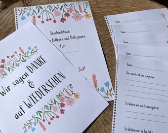May include: A white farewell book with a floral border and the text "Wir sagen DANKE & auf WIEDERSEHEN" in black. The book has a spiral binding and is open to a page with the text "Abschiedsbuch Kolleginnen und Kollegen für Zeit!" in black.