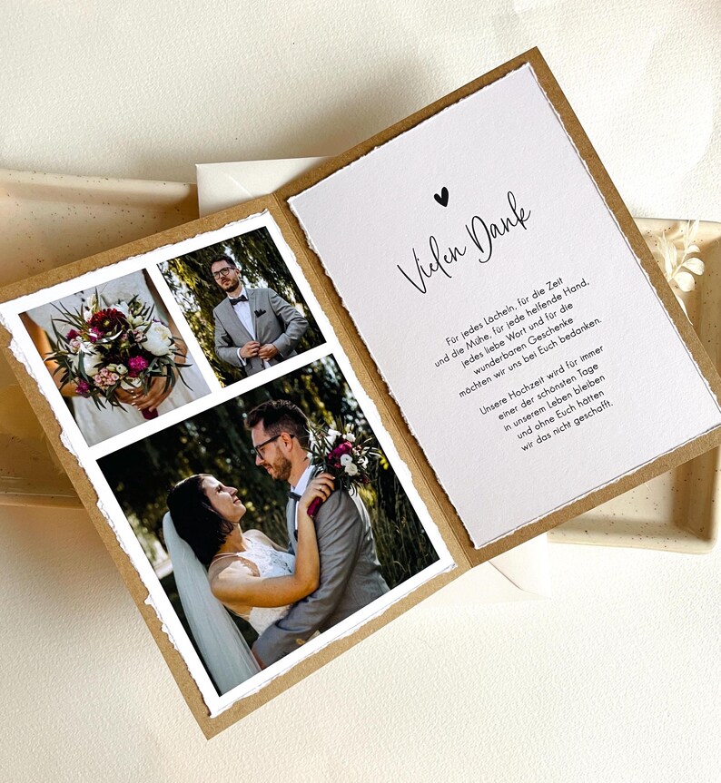 May include: A wedding thank you card with a rustic brown paper texture. The card features a collage of three photos of the wedding couple. The text on the card reads "Vielen Dank" and includes a message of gratitude for the guests' presence and gifts.