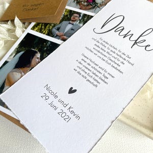 May include: A white card with a handwritten thank you message in black ink. The card has a small heart symbol and the text "Nicole and Kevin 29. June 2021".