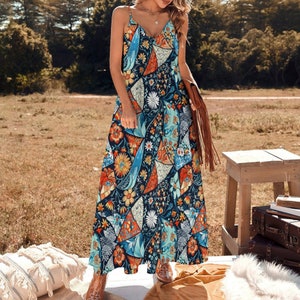 May include: A long, sleeveless maxi dress with a V-neckline and a colorful, geometric print. The dress is made of a lightweight fabric and has a flowy silhouette.