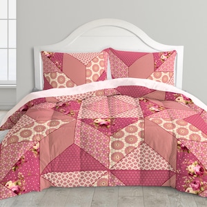 May include: A patchwork quilt and two pillowcases in shades of pink, cream, and rose. The quilt features geometric patterns, floral accents, and a variety of textures. The bedding set is displayed on a white headboard, creating a cozy and inviting bedroom aesthetic.