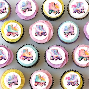 May include: Twelve cupcakes decorated with round edible images of roller skates with watercolour-style backgrounds. The cupcakes are arranged in three rows of four, with a variety of colours and designs.