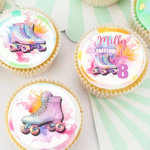 May include: A set of four cupcake toppers featuring watercolour-style illustrations of roller skates. The toppers are decorated with colourful splatters and the text "Milly is rolling into 8".