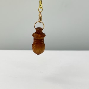 Pendule de radiesthésie en bois d' Olivier fait main, vendu avec sa boite et son sachet de transport