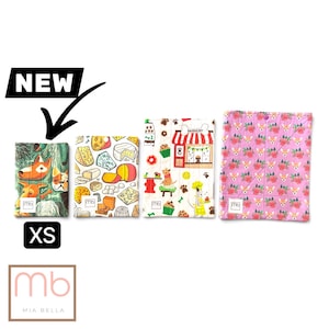 May include: Four rectangular fabric pouches with snap closures, each featuring a unique pattern: one with dog faces, one with various cheeses, one with a bakery storefront, and one with small dog faces and flowers. Each pouch has a small white label.
