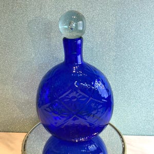 1930s Cobalt Blue Glass Bottle: Embossed Floral Diamond Pattern, Clear Stopper