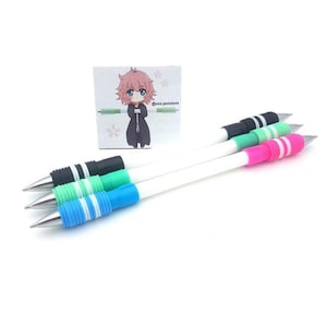 May include: Three white mechanical pencils with colorful grip sections. The grip sections are black and white, green and white, and pink and white. The pencils are on a white surface. @uxz.penstore