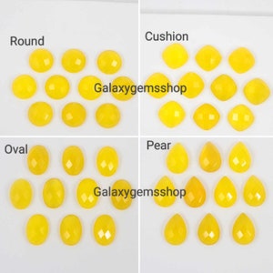 May include: Assortment of yellow gemstone cabochons in various shapes, including round, cushion, oval, and pear. The stones are arranged in rows by shape. Galaxygemsshop is printed on the image.
