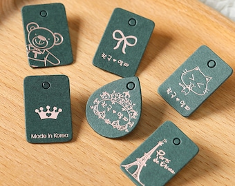 500 Stück Benutzerdefinierte Mini Swing Tags Schmuckanhänger Tiny Hang Tags Schmuck-Verpackung Geschenk-Verpackung Produkttags Produkttags Preisschilder kundenspezifisches Logo