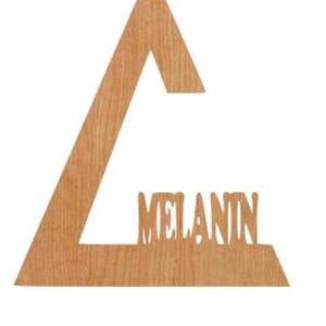 May include: Wooden wall art in the shape of a large letter "A" with the word "MELANIN" cut out. The art is made of light brown wood and has a hole at the top for hanging.