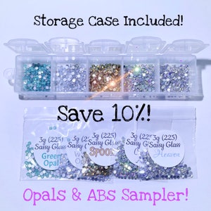 May include: A clear plastic storage case filled with various colors of rhinestones. Below, small bags of rhinestones are labeled "Green Opal", "White Opal", "Spook", and "Cloud Heaven". Text reads "Storage Case Included!" and "Save 10%!" The words "Opals & ABS Sampler!" are also visible.
