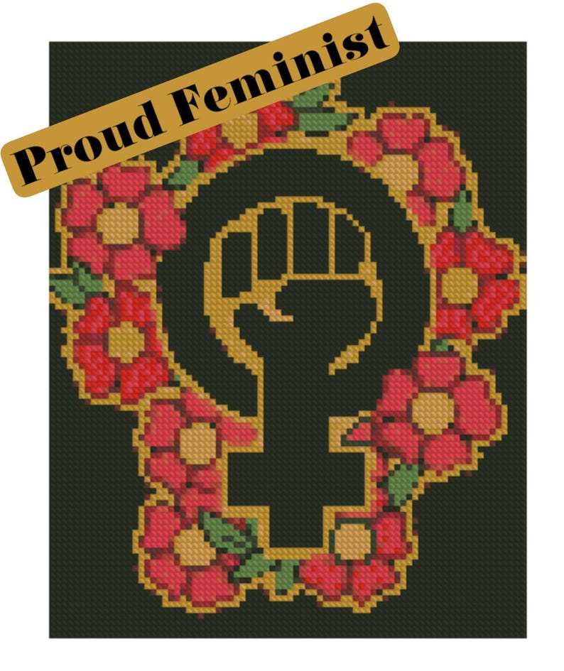 May include: A cross-stitch design featuring the feminist symbol, a raised fist within a female symbol, surrounded by red flowers with yellow centres and green leaves. The words "Proud Feminist" are displayed on a gold banner.