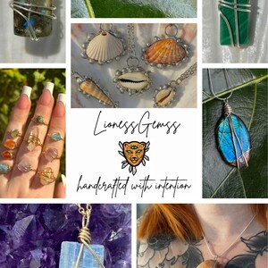 May include: A collection of handcrafted gemstone jewelry, including necklaces with labradorite, amethyst, malachite, and a blue iridescent stone. Rings with various gemstones are also displayed. The image includes the text "Lioness Gemss handcrafted with intention."