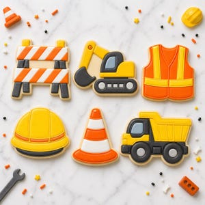 May include: A collection of construction-themed cookies, including a yellow hard hat, orange and white traffic cones, a barrier, a dump truck, an excavator, and a safety vest. The cookies are decorated with orange, yellow, black, and white icing.