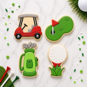 May include: Four golf-themed cookies: a red golf cart, a green putting green with a red flag, a green golf bag with clubs, and a golf ball on a tee. The cookies are decorated with icing and surrounded by green and white sprinkles.