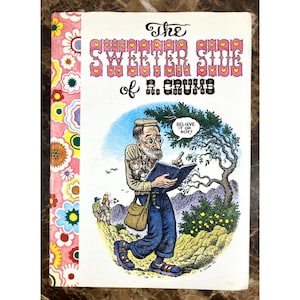 May include: A vintage book titled "The Sweeter Side of R. Crumb" with a colorful floral design on the spine. The cover features an illustration of a man reading a book, with the text "Believe it or not?"