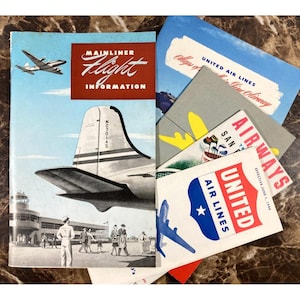 May include: Vintage travel ephemera featuring United Airlines and Mainliner Flight Information. The collection includes brochures and maps with illustrations of airplanes, airports, and stylized text. The color palette includes red, blue, and white.