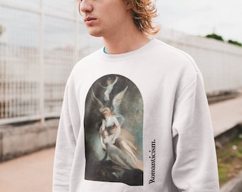 May include: White sweatshirt with a vintage painting of a woman with angel wings. The painting is in a circular frame and the text "Romanticism." is printed vertically on the right side of the sweatshirt.