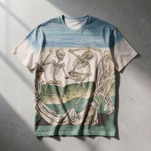 May include: A short-sleeve t-shirt featuring an all-over print of a historical illustration depicting multiple skeletons dancing in a landscape. The design includes a blue sky gradient at the top, green hills, and white draped fabric elements.
