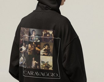 May include: Black hooded sweatshirt with a graphic print of a collage of paintings by Caravaggio. The text "CARAVAGGIO." is printed below the collage.