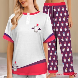 May include: White short-sleeved pajama top with red and purple trim, featuring a cartoon bat-like creature. Matching purple pajama bottoms with a repeating creature pattern. The pajama set has a button-up neckline.