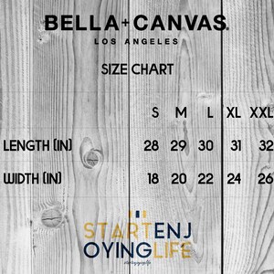 May include: Size chart for Bella + Canvas t-shirts, showing length and width measurements in inches for sizes S, M, L, XL, and XXL.