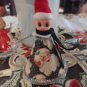 Christmas pixie elf holding snowflake