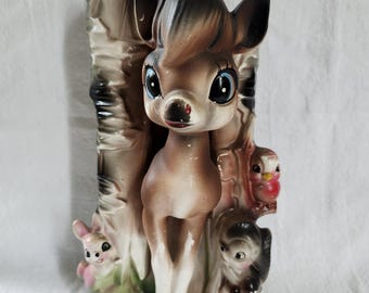 Macetero vintage con ciervos y otros animales