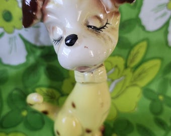 Vintage yellow polka dot dog shaker