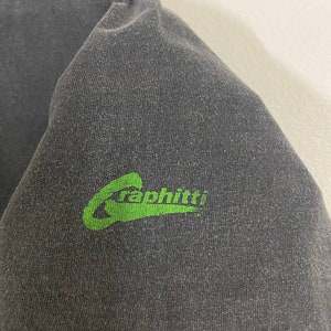 May include: A black t-shirt with a green "Graphiti" logo on the bottom right corner.