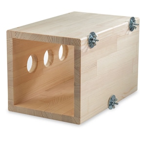 May include: A wooden box with three round holes cut into one side. The box has metal brackets on each corner.
