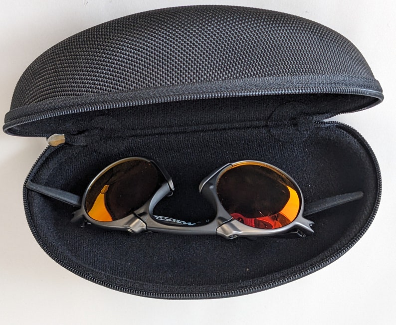 Oakley Madman Dark Carbon Ruby Iridium Polarized Sunglasses Slightly ...