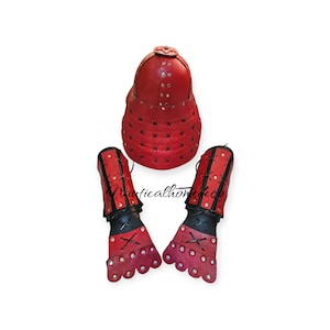 May include: Red leather samurai armor set with a helmet, arm guards, and gauntlets. The armor is decorated with black stitching and rivets.