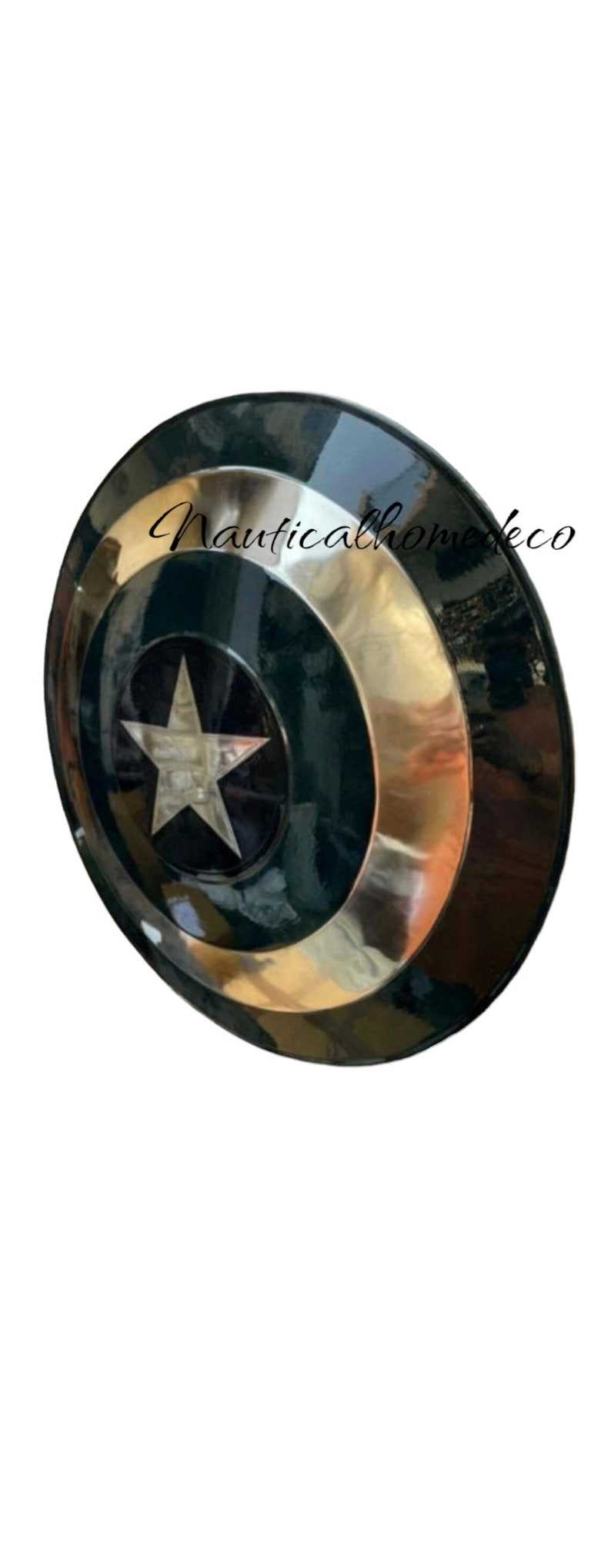 May include: A round, metal Captain America shield with a red, white, and blue design. The shield is painted black with a silver star in the centre.