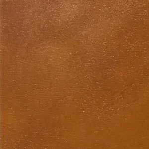 Contrail Film Camera - Close-up of caramel brown leather texture on restored Olympus Trip 35 film camera