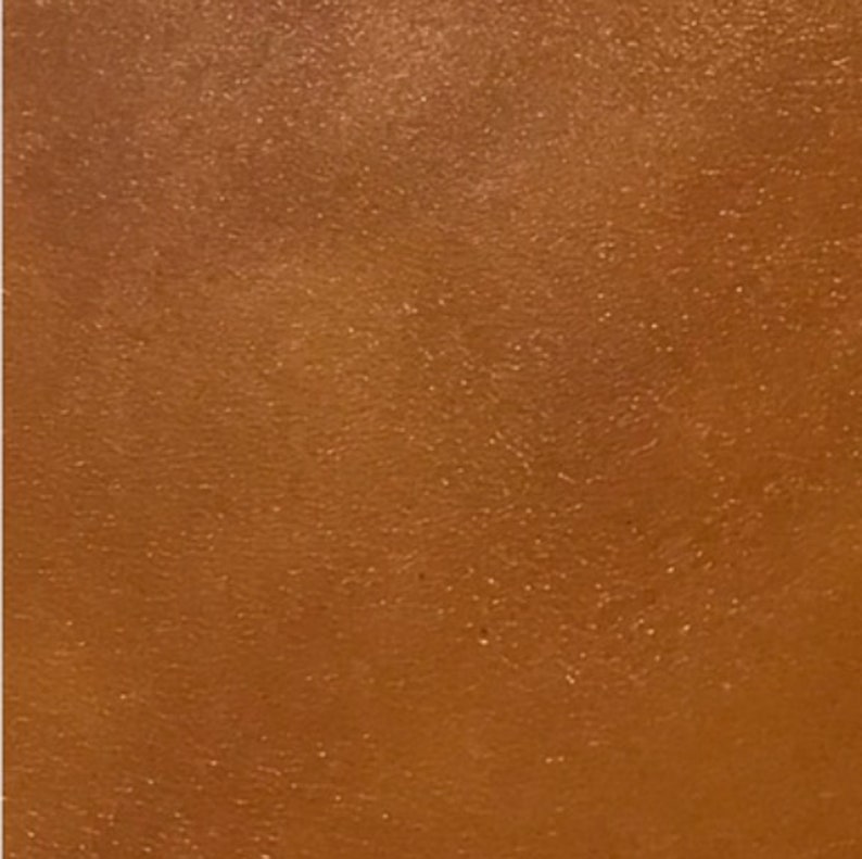 Contrail Film Camera - Close-up of caramel brown leather texture on restored Olympus Trip 35 film camera