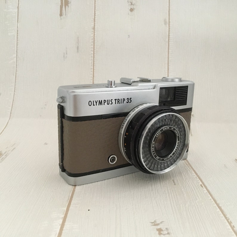 Contrail Film Camera - Left-side view of Olympus Trip 35 film camera with fawn leather covering