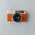 Konica C35 Rangefinder Film Camera | Refurbished & Tested in Japan | Hexanon 38mm Lens | Apricot Orange Leather
