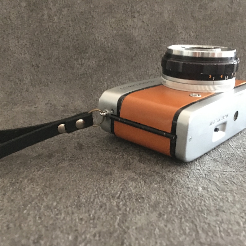 Contrail Film Camera - Left-side view of Olympus Trip 35 film camera with caramel brown leather covering