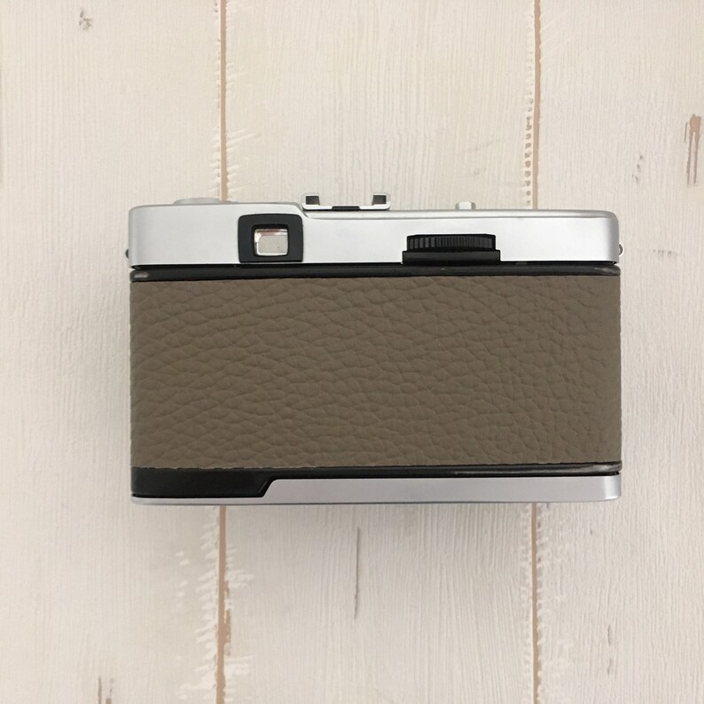 Contrail Film Camera - Back view of Olympus Trip 35 camera with fawn leather, showing controls and texture