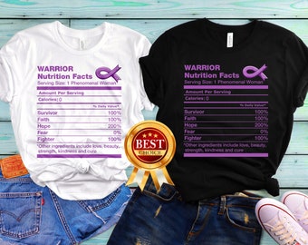 May include: Two t-shirts with a purple ribbon and a nutrition facts label that reads "Warrior Nutrition Facts" with the text "Serving Size: 1 Phenomenal Woman". The label lists "Survivor", "Faith", "Hope", "Fear", and "Fighter" with a percentage value for each. The text at the bottom of the label reads "Other ingredients include love, beauty, strength, kindness and cure".
