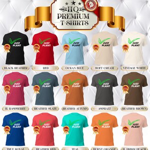 May include: A display of various colored t-shirts, each featuring the text "JUST PLANT" with a green leaf design. The shirts come in a variety of colors, including black, red, blue, and orange. The image also includes the text "HQ Premium T-Shirts".
